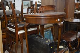 A REPRODUCTION MAHOGANY DEMI LUNE FOLD OVER CARD TABLE and four modern dining chairs (5)