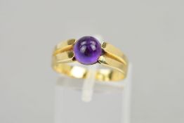 A MODERN SINGLE STONE CABOCHON CUT AMETHYST RING, cabochon measuring approximately 7.10mm in