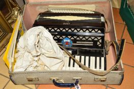 A CASED CAPRI ACCORDIAN, some sheet music