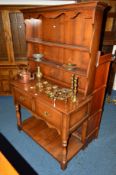A TITCHMARSH AND GOODWIN STYLE OAK DRESSER, with a two tier plate rack above two deep drawers on
