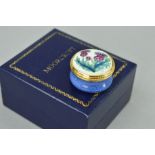 A BOXED MOORCROFT ENAMEL PILL BOX, decorated with Thistles