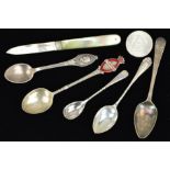 FIVE TEASPOONS, A FRUIT KNIFE AND A COIN, two of the spoons with twisted necks, one with red