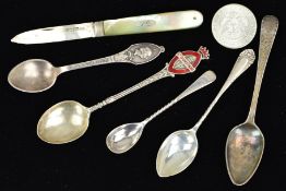 FIVE TEASPOONS, A FRUIT KNIFE AND A COIN, two of the spoons with twisted necks, one with red