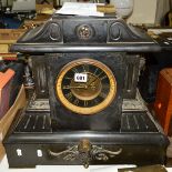 A LATE VICTORIAN BLACK SLATE MANTEL CLOCK OF ARCHITECTURAL FORM, black and gilt dial with Roman