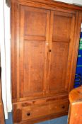 A VICTORIAN OAK PANELLED TWO DOOR CUPBOARD, with reeded front side edges above a single long drawer,
