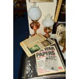 TWO COPPER/BRASS OIL LAMPS, together with a folder of reproduction war newspapers