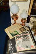 TWO COPPER/BRASS OIL LAMPS, together with a folder of reproduction war newspapers