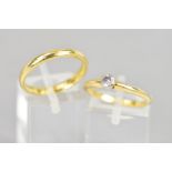 AN 18CT GOLD SINGLE STONE DIAMOND RING AND AN 18CT GOLD BAND RING, the single stone ring collet