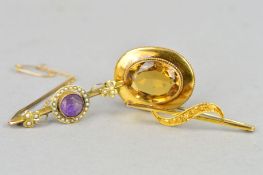 THREE EARLY 20TH CENTURY GOLD BROOCHES, the first of oval outline set with a citrine within a rope