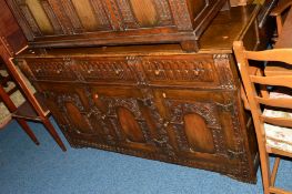 A REPRODUCTION CARVED OAK SIDEBOARD with three drawers, approximate width 155cm x depth 45cm x