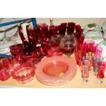 A QUANTITY OF CRANBERRY COLOURED GLASS to include glasses, plates and decorative items