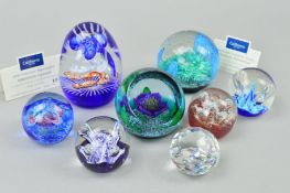 SEVEN CAITHNESS GLASS YEARLY PAPERWEIGHTS to include 'Tropicana' 1996, 'Aquamarina' 1998, 'Millenium