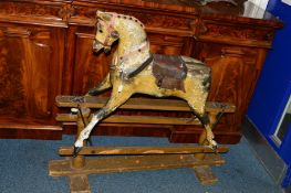 A VICTORIAN PAINTED ROCKING HORSE ON A PINE STAND, approximate width 107cm x height 96cm