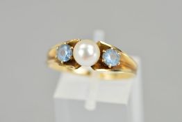 A CULTURED PEARL AND BLUE GEM RING, designed as a central cultured pearl flanked by circular blue