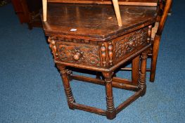 A REPRODUCTION CARVED OAK CANTED FOLD OVER TEA TABLE with a single drawer