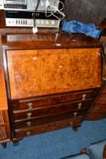 A REPRODUCTION BURR WALNUT FALL FRONT BUREAU with four exterior drawers, approximate width 74cm x