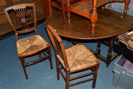 A 20TH CENTURY OAK OVAL TOPPED GATE LEG TABLE and six Edwardian mahogany rush seated chairs (7)
