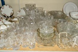 A QUANTITY OF CUT GLASS to include a pair of Webb Corbet candlesticks, vases, bowls and jugs, etc (