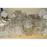 A QUANTITY OF CUT GLASS to include a pair of Webb Corbet candlesticks, vases, bowls and jugs, etc (