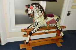 A HADDON ROCKERS DAPPLED GREY ROCKING HORSE, upholstered saddle, tan leather tack, horse hair mane