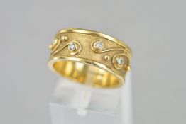 A LATE 20TH CENTURY BYZANTINE STYLE DIAMOND SET BAND RING, satin finish with applied bead work