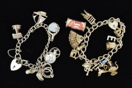 TWO CHARM BRACELETS, both with curb link bracelets suspending a total of eighteen charms to