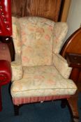 A REPRODUCTION GEORGIAN STYLE MAHOGANY FRAMED WING BACK ARMCHAIR