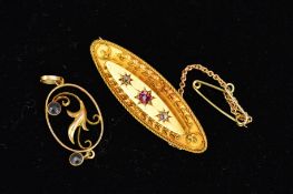 A LATE VICTORIAN 15CT GOLD GEM BROOCH AND AN EARLY 20TH CENTURY PENDANT, the elongated brooch with