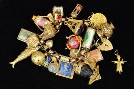 A MID 20TH CENTURY 9CT GOLD FANCY LINK CHARM BRACELET, together with twenty three (one loose)