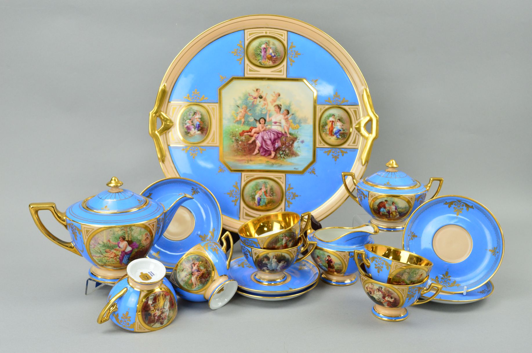 AN AUSTRIAN PORCELAIN TEASET, handpainted classical scenes and signed Forst, comprising teapot, milk