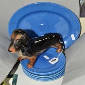 A BESWICK DACHSHUND, No.361, together with Moorcroft pottery powder blue plates and platter (8)