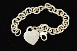 A TIFFANY & CO BRACELET, designed as a belcher link bracelet suspending a heart shape panel