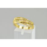 A LATE 20TH CENTURY 18CT GOLD DIAMOND SET CROSS OVER ETERNITY RING, total eight cut weight