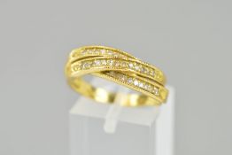 A LATE 20TH CENTURY 18CT GOLD DIAMOND SET CROSS OVER ETERNITY RING, total eight cut weight