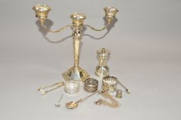 AN ELIZABETH II THREE LIGHT SILVER CANDELABRUM on a hexagonal stem and stepped loaded foot,