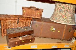 A VINTAGE TRAVELLING TRUNK, two wicker baskets, two wooden trays and a standard lamp (7)