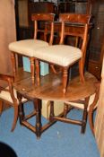 A GEORGIAN OAK OVAL TOPPED DROP LEAF TABLE and four Victorian mahogany bar back chairs (5)