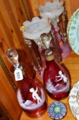 A PAIR OF MARY GREGORY STYLE RUBY COLOURED DECANTERS, approximate height 30cm, together with a