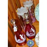 A PAIR OF MARY GREGORY STYLE RUBY COLOURED DECANTERS, approximate height 30cm, together with a