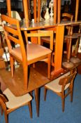 A 1950'S TEAK DINING SUITE comprising of an extending table with four chairs and a sideboard with