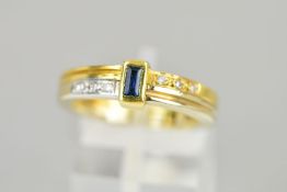 A SAPPHIRE AND DIAMOND RING, designed as a collet set rectangular sapphire to the bi-colour bands