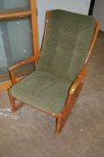 A MID CENTURY PARKER KNOLL ROCKING CHAIR