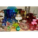 A LARGE QUANTITY OF COLOURED GLASS to include cranberry and blue table lustres and lamp work