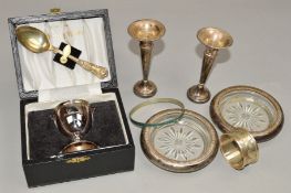 A CASED SILVER EGG CUP, engraved 'Simon', together with a silver spoon, a pair of silver posy