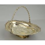 A SILVER PLATED WALKER AND HALL BASKET WITH HINGED HANDLE, of oval outline, the bowl engraved with