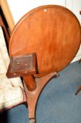 A VICTORIAN WALNUT CIRCULAR TILT TOP BREAKFAST TABLE