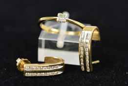 A 9CT GOLD SINGLE STONE DIAMOND RING AND A PAIR OF 14CT GOLD DIAMOND EARRINGS, the ring designed