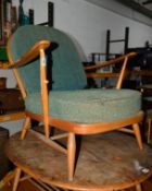 AN ERCOL 1960'S BEECH FRAMED ARMCHAIR and three blonde Ercol stick back chairs (in need of