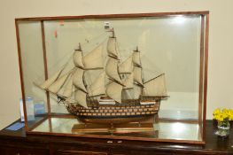 A 20TH CENTURY MODEL GALLEON IN A GLAZED CASE, plaque reading HMS Victory 1805, model built by