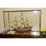 A 20TH CENTURY MODEL GALLEON IN A GLAZED CASE, plaque reading HMS Victory 1805, model built by